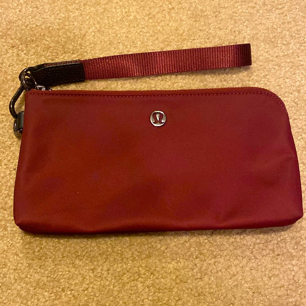 Lululemon curved wristlet mini clutch.
